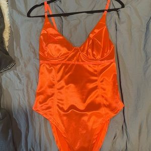 Bright orange body suit